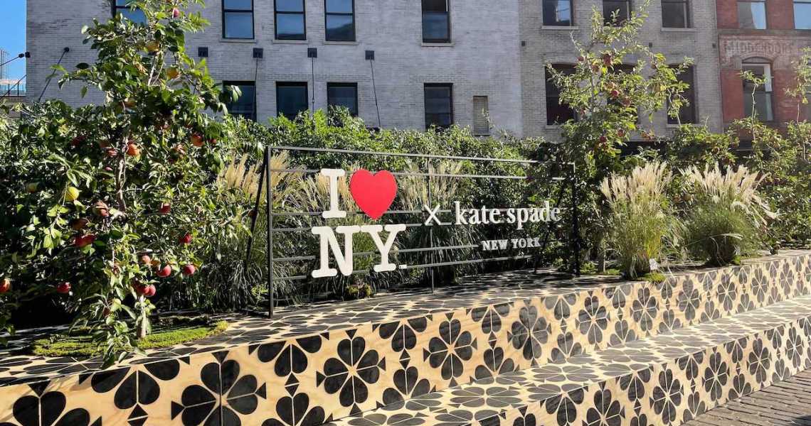 The lead image features a photo of the Kate Spade New York Fashion Week sign.