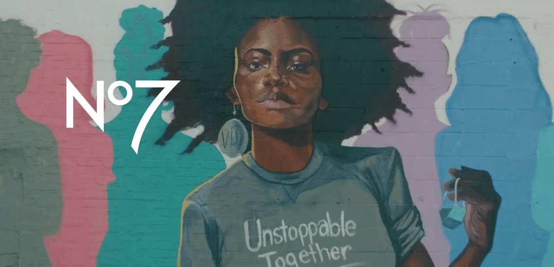 Promotional image from No7 featuring a black woman wearing a shirt that says "Unstoppable Together."