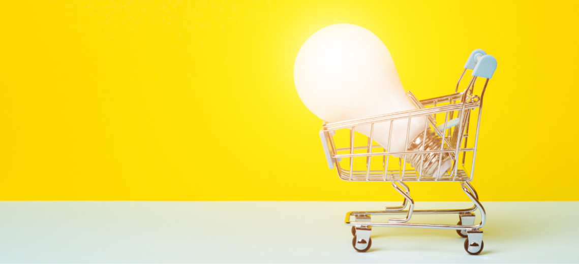 picture of a shopping cart with a bright, oversized lightbulb shining inside.