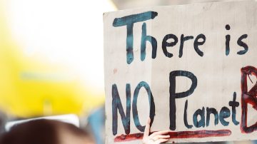 Photograph of sign that reads "there is no planet B."