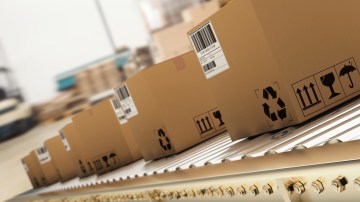 Photograph of boxes on a conveyor belt.